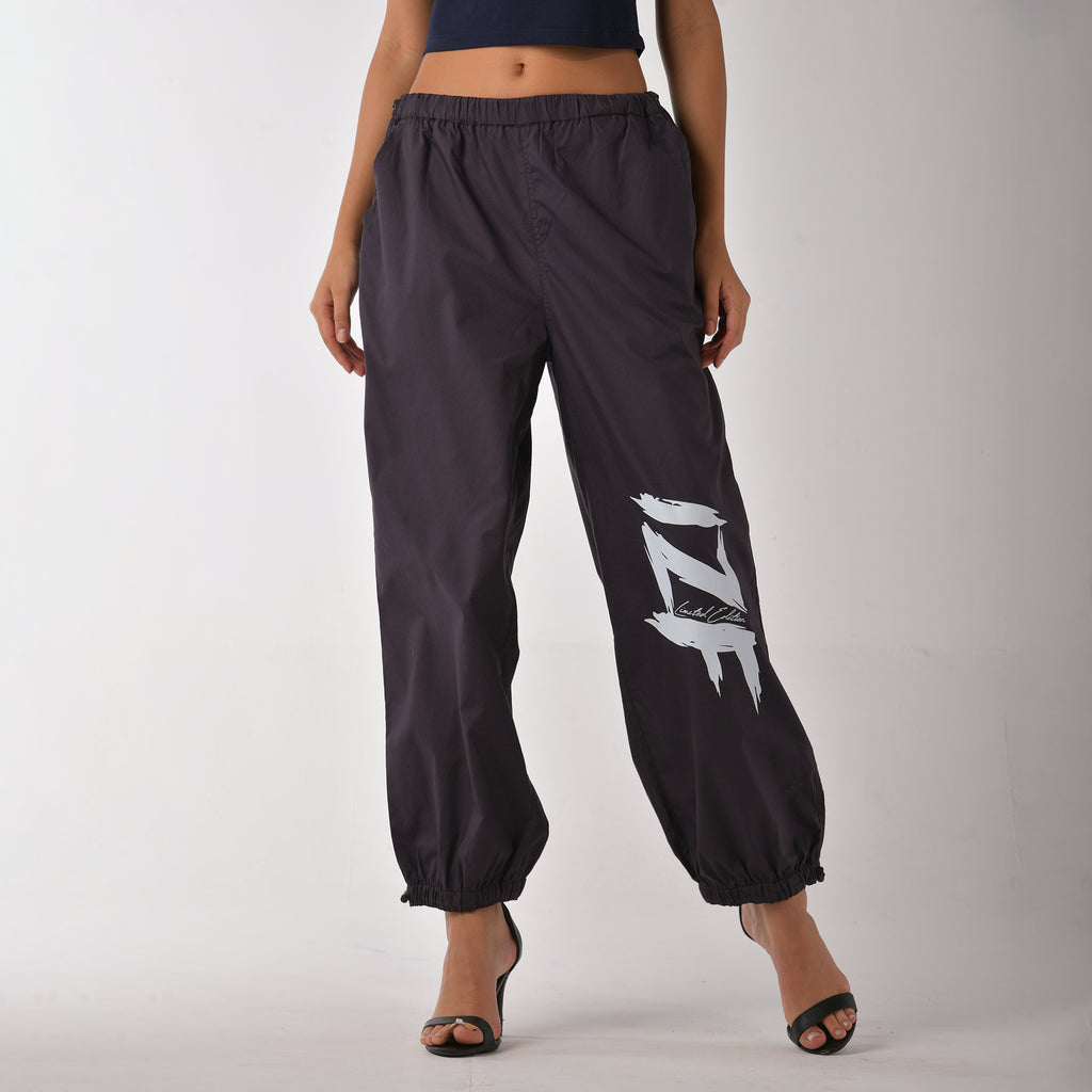 Printed "Limited edition" parachute pants for women