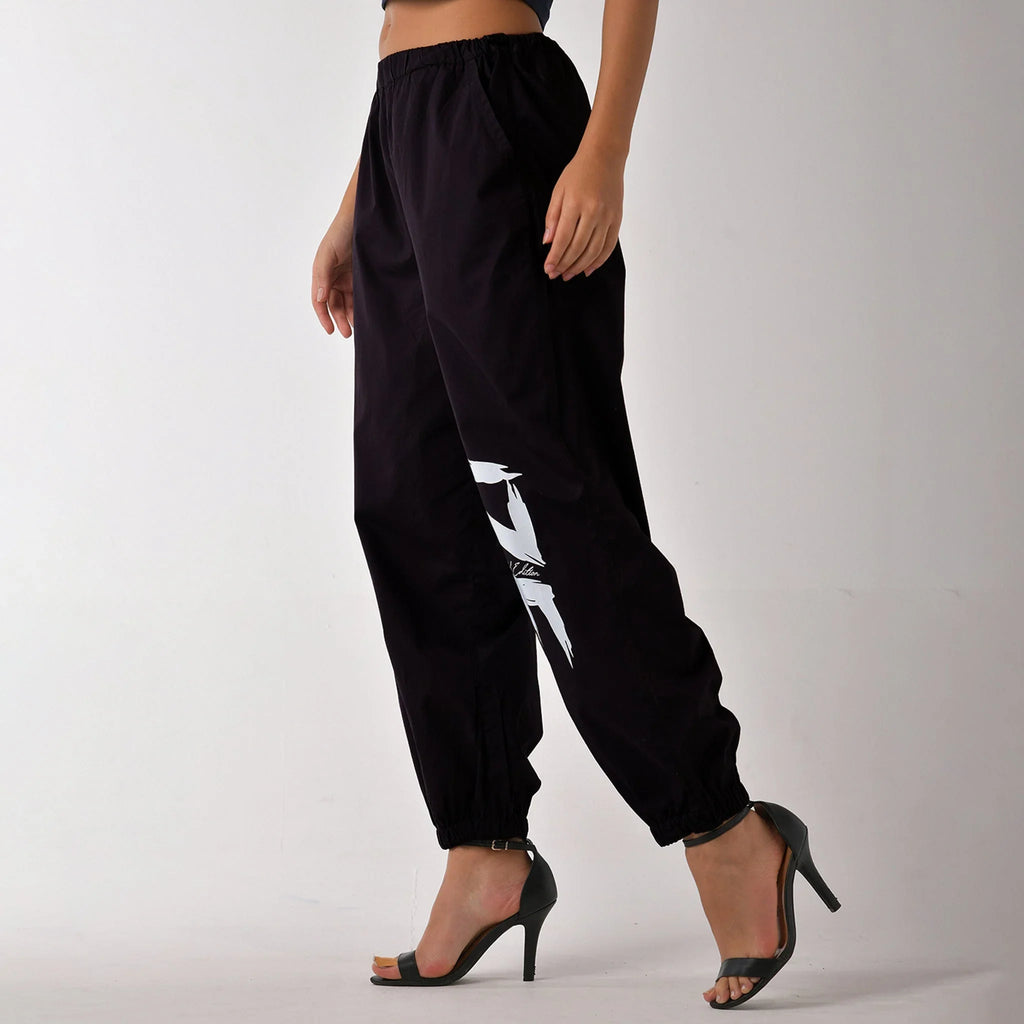 Printed "Limited edition" parachute pants for women in Black - I Z F