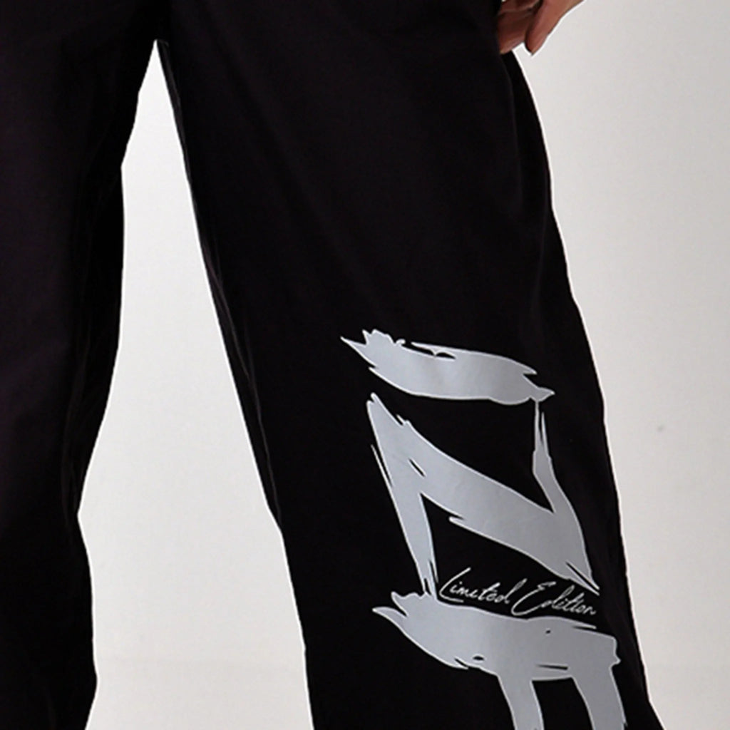 Printed "Limited edition" parachute pants for women in Black - I Z F