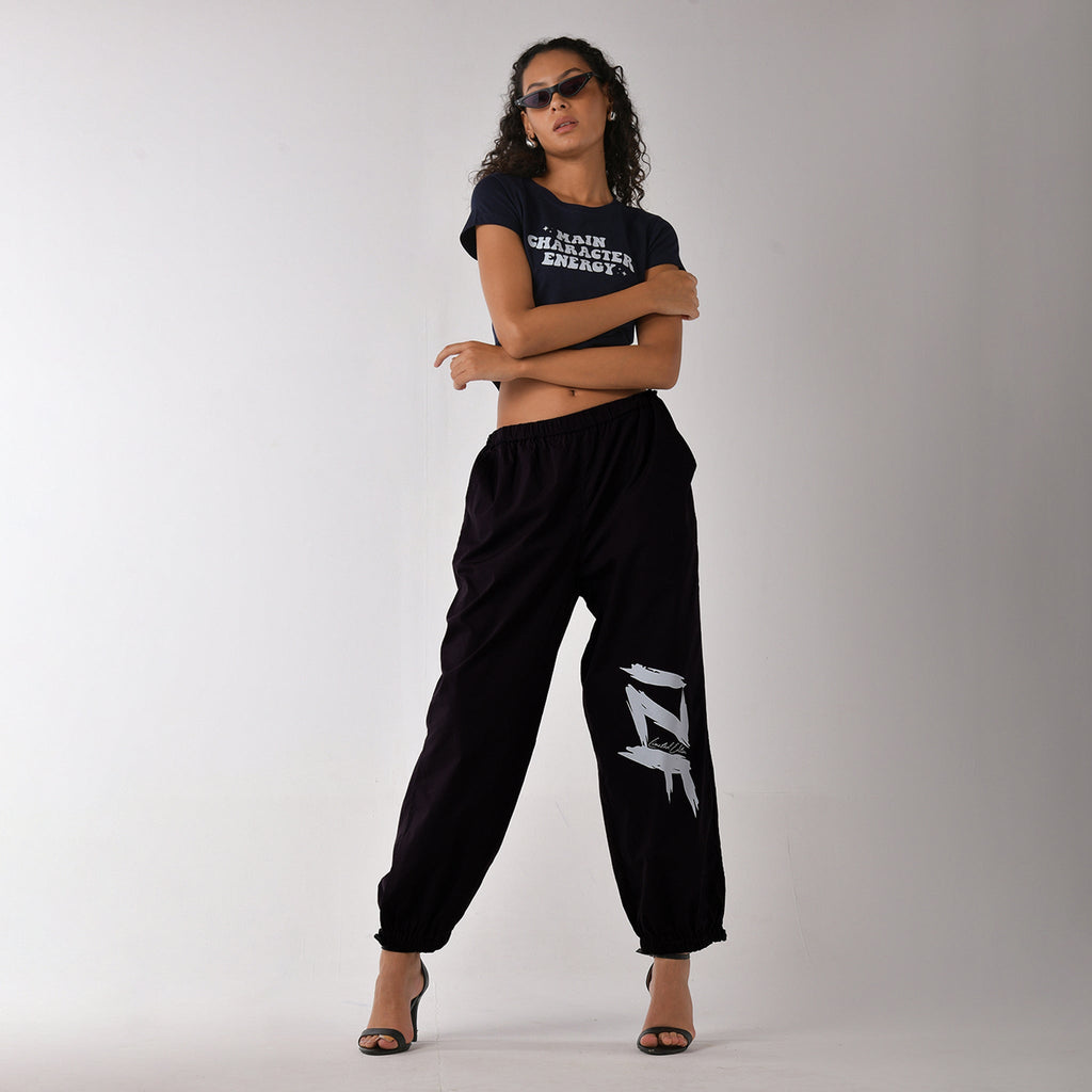 Printed "Limited edition" parachute pants for women in Black - I Z F