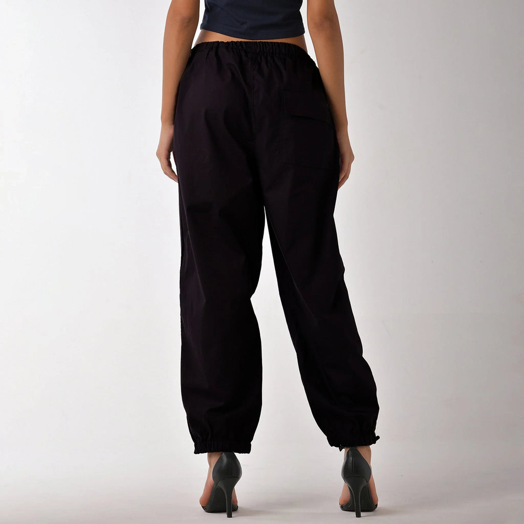 Printed "Limited edition" parachute pants for women in Black - I Z F