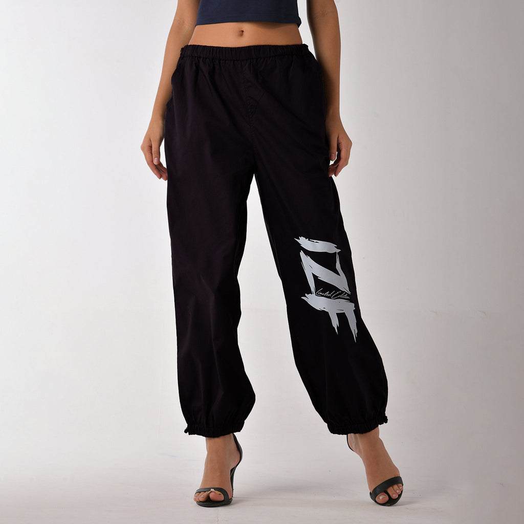 Printed "Limited edition" parachute pants for women in Black - I Z F