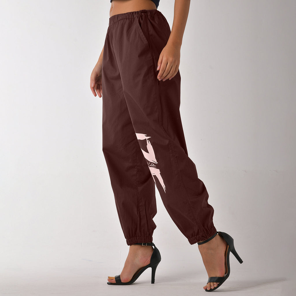 Printed "Limited edition" parachute pants for women in Brown - I Z F