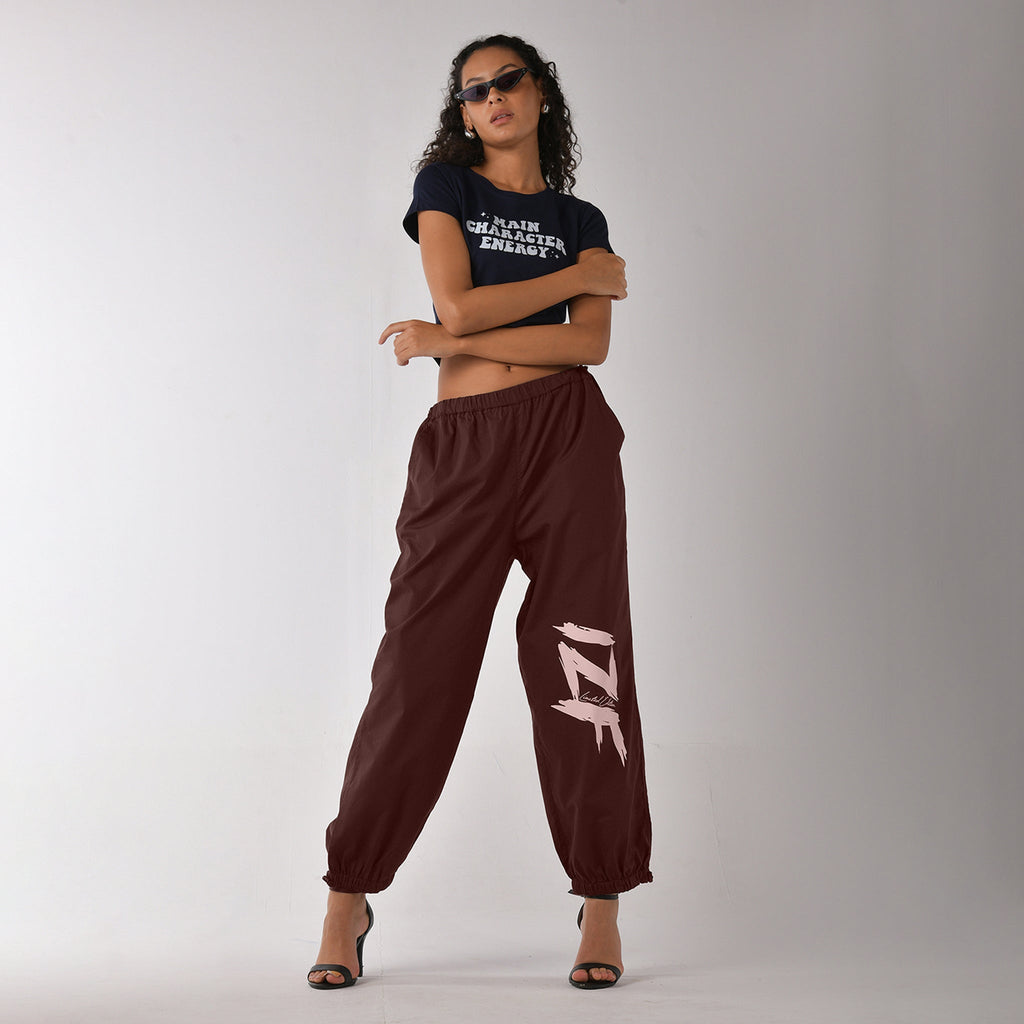 Printed "Limited edition" parachute pants for women in Brown - I Z F