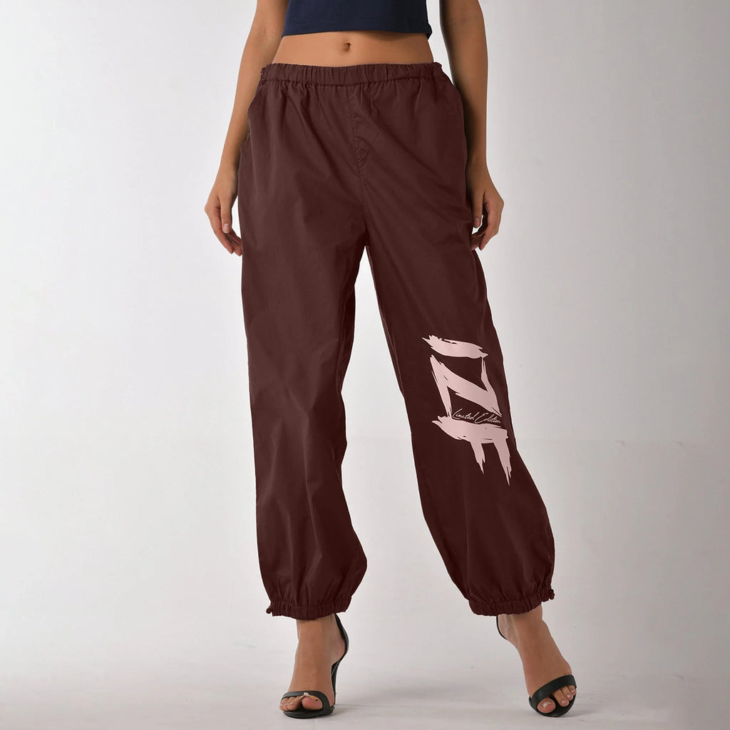 Printed "Limited edition" parachute pants for women in Brown - I Z F