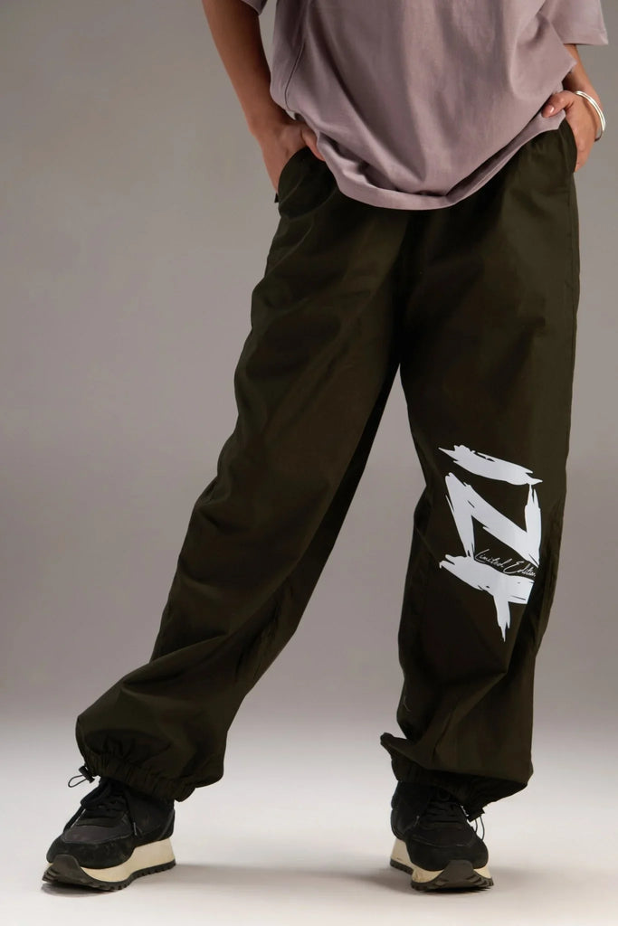 Printed "Limited edition" parachute pants for women in Green - I Z F
