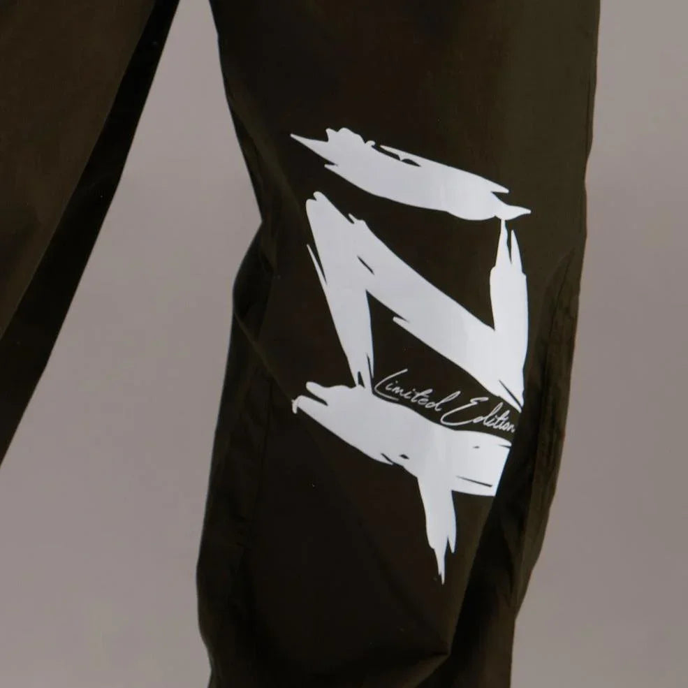 Printed "Limited edition" parachute pants for women in Green - I Z F